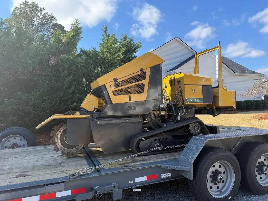 DipperFox stump grinder processing stump on residential property