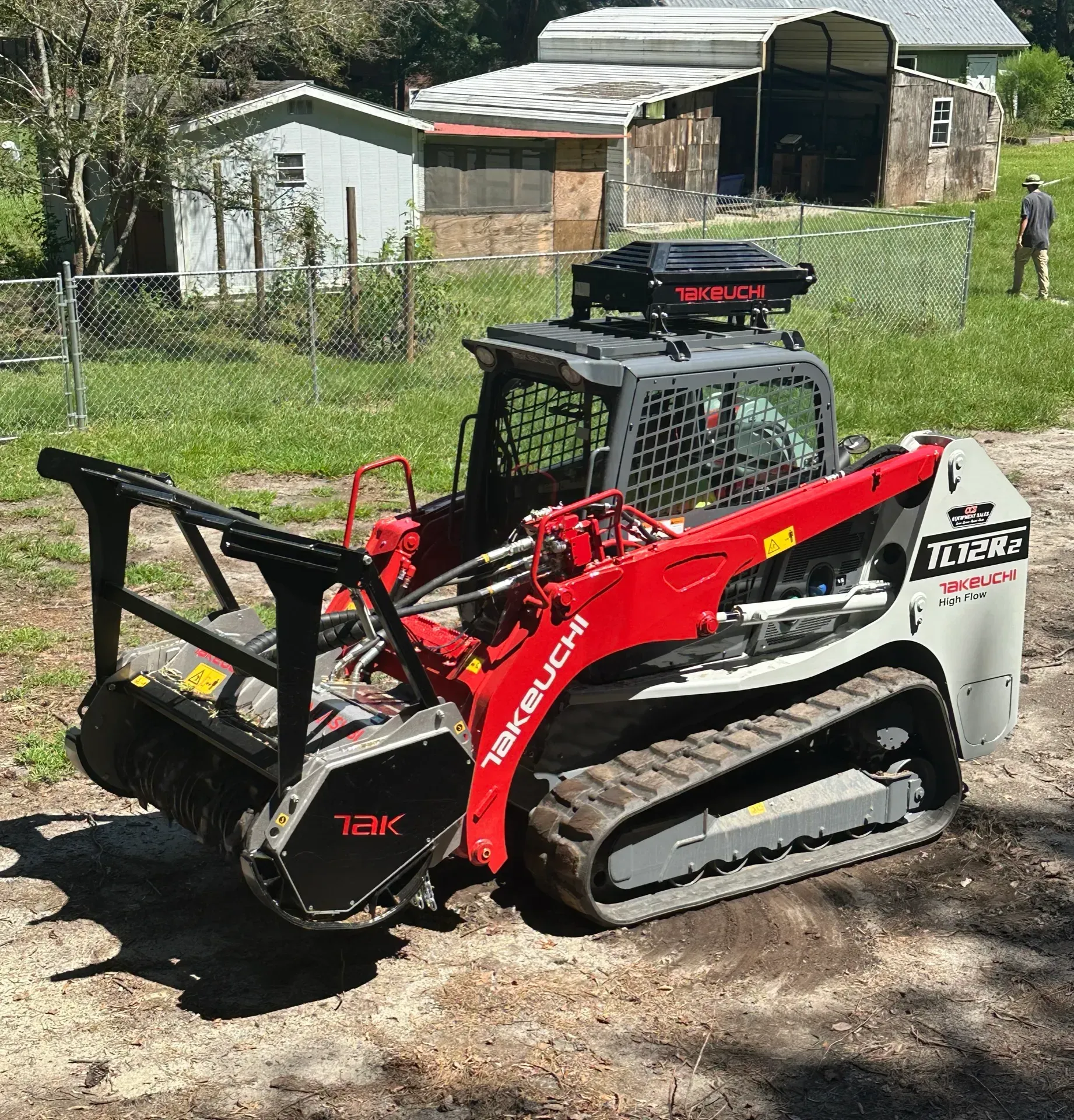 Takeuchi forestry mulcher clearing brush in Wilson