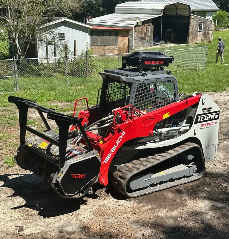 Takeuchi TL12R2 with FAE forestry mulcher head clearing brush