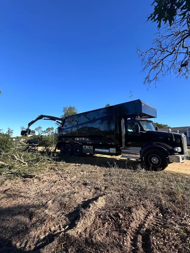 Grapple truck at completed clearing site