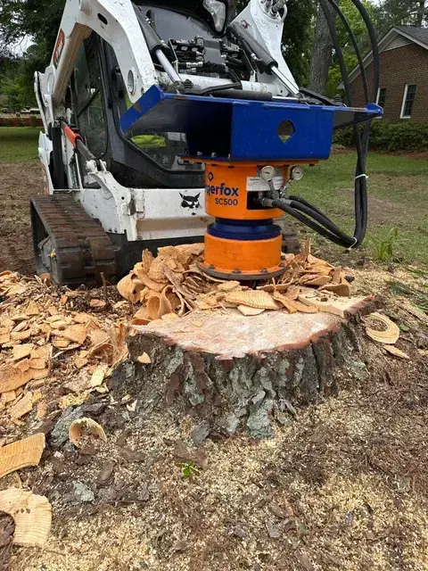 Dipperfox SC500 stump grinder attachment working a fresh stump