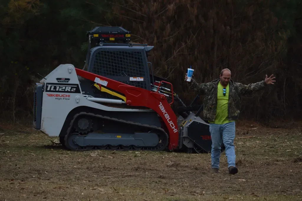 DC Tree Cutting crew with Takeuchi tracked loader at a job site